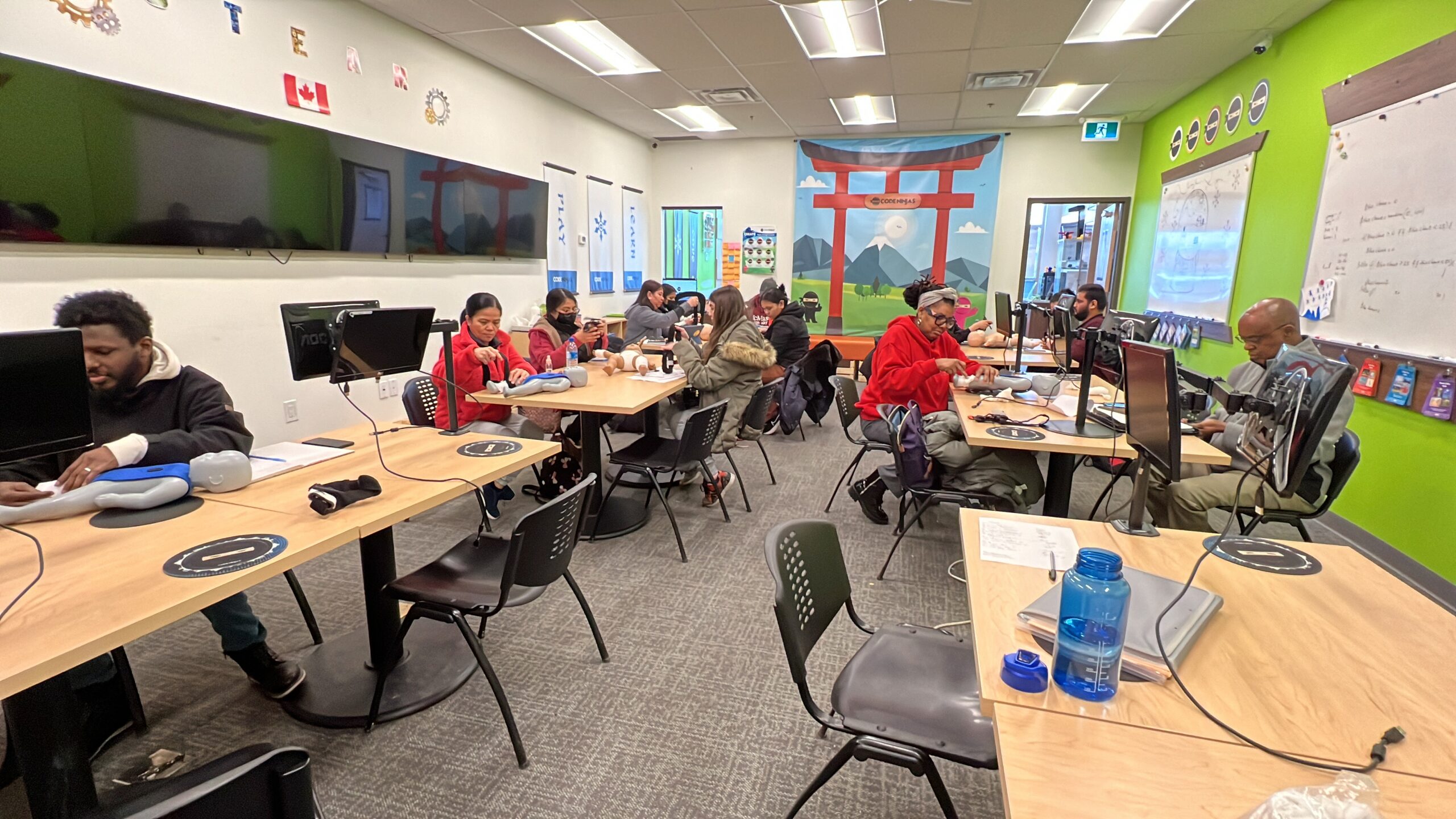 Students in a first aid and CPR class at The Academy for First Aid and Safety