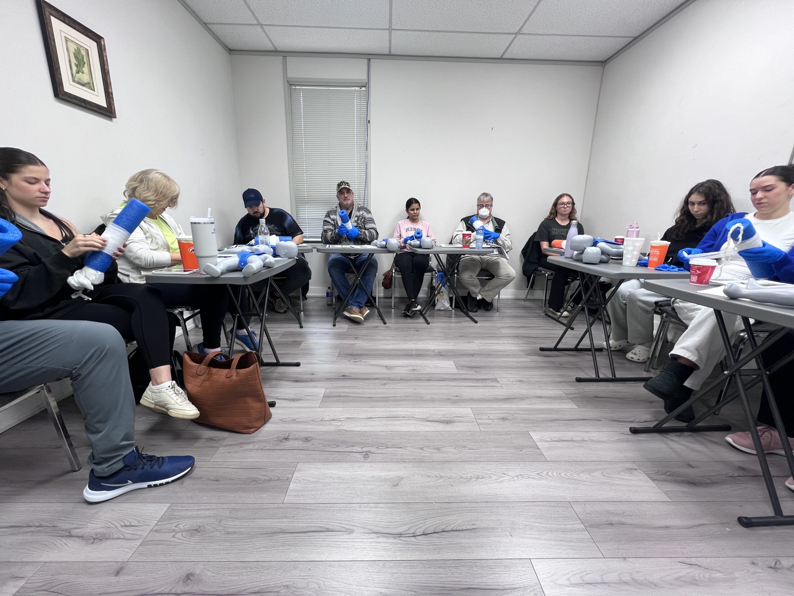 Students practising splinting in an Academy first aid class